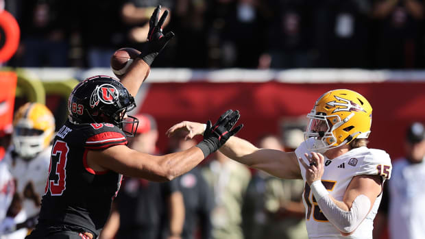 Nov 4, 2023; Salt Lake City, Utah, USA; Arizona State Sun Devils quarterback Jacob Conover (15) has pass deflected by Utah Utes defensive end Jonah Elliss (83) in the second quarter at Rice-Eccles Stadium. Mandatory Credit: Rob Gray-USA TODAY Sports